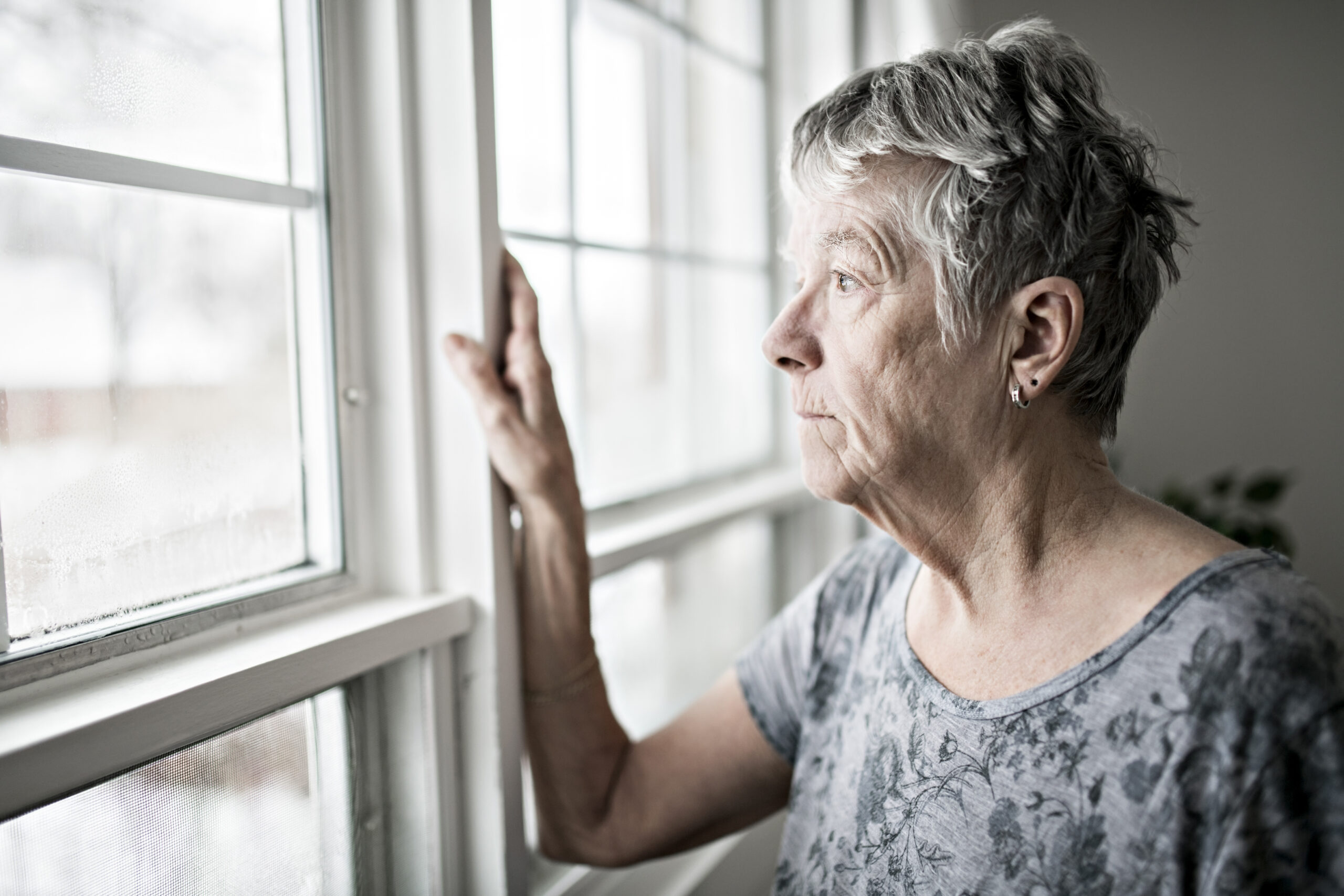 woman looking out the window collage